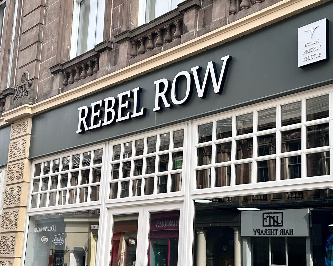 Store front of Rebel Row with tartan patterns displayed in the window